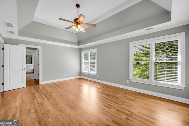 3641 Carriage Glen Way, Dacula, GA 30019 - unfurnished bedroom featuring a tray ceiling, light wood-type flooring, baseboards, and crown molding