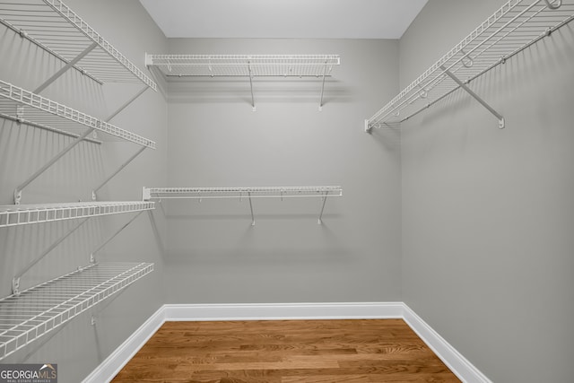 3641 Carriage Glen Way, Dacula, GA 30019 - walk in closet featuring wood finished floors