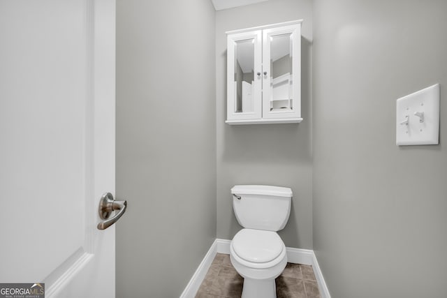 3641 Carriage Glen Way, Dacula, GA 30019 - bathroom featuring toilet and baseboards