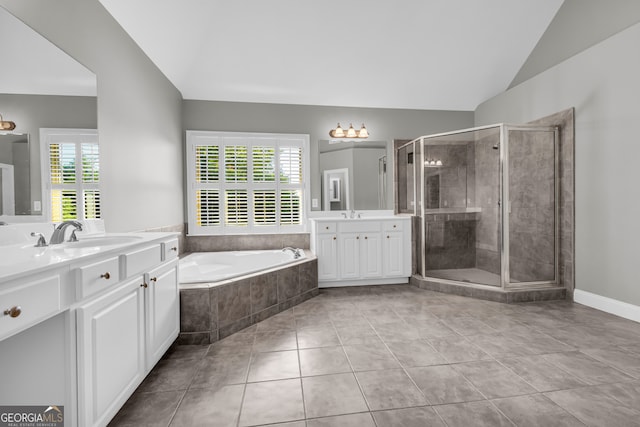 3641 Carriage Glen Way, Dacula, GA 30019 - full bath featuring two vanities, tile patterned flooring, a garden tub, a stall shower, and vaulted ceiling