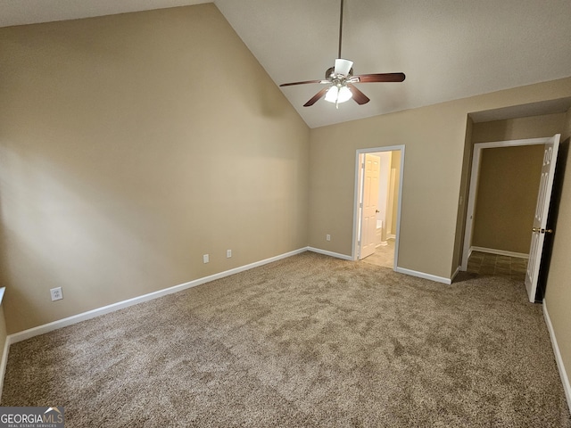 unfurnished bedroom featuring a ceiling fan, vaulted ceiling, carpet floors, baseboards, and connected bathroom