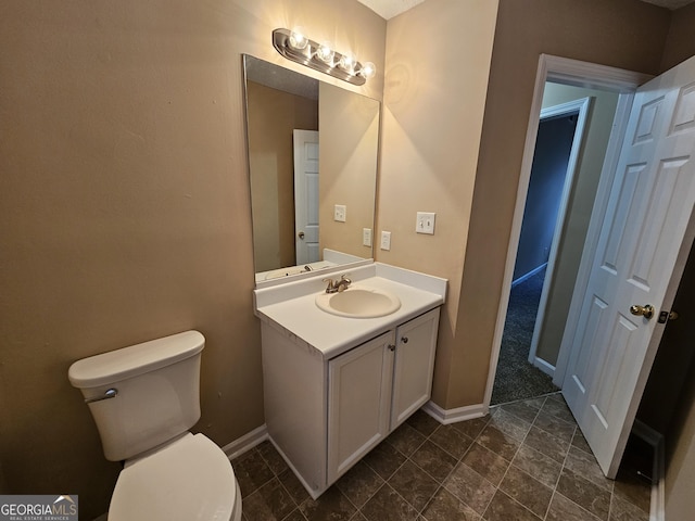3081 Regal Dr, Mcdonough, GA 30253 - bathroom with toilet, baseboards, and vanity