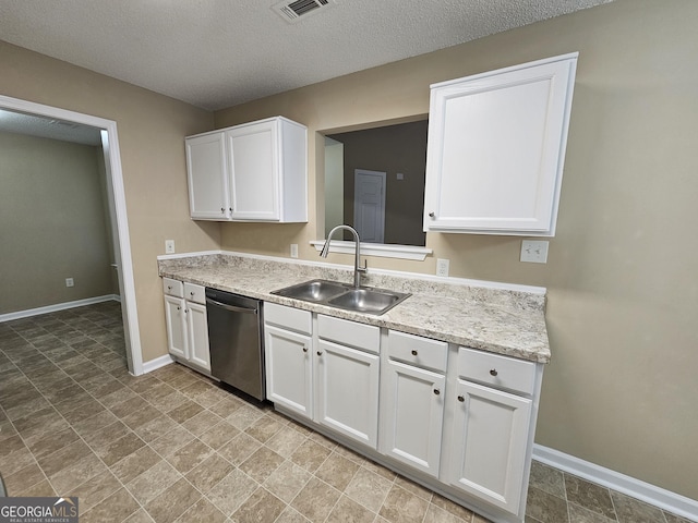 kitchen featuring stainless steel dishwasher, visible vents, baseboards, white cabinetry, and a sink