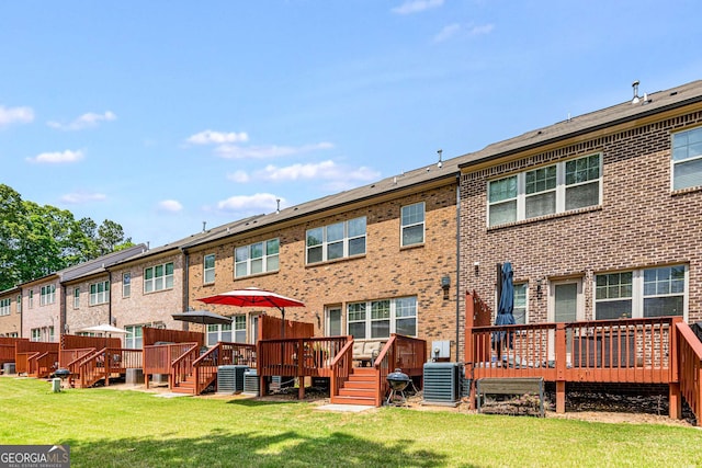 5934 Norfolk Chase Rd, Peachtree Corners, GA 30092 - back of house featuring cooling unit, brick siding, a wooden deck, and a lawn