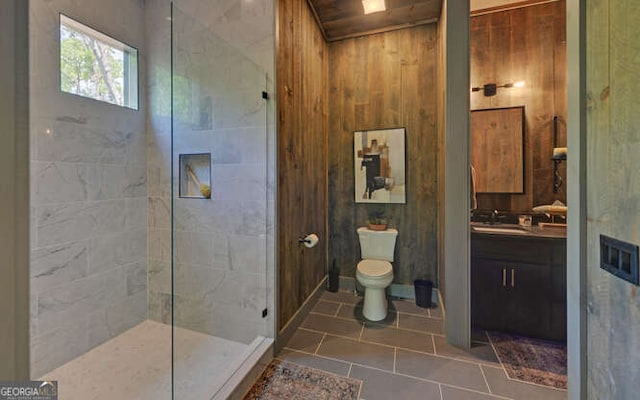 full bathroom featuring vanity, tile patterned floors, walk in shower, and toilet