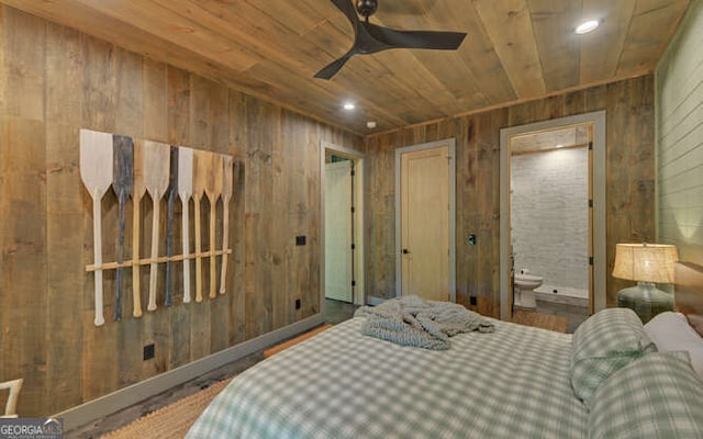 bedroom with wooden walls, wood ceiling, and ensuite bathroom