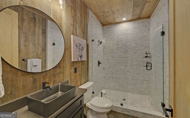 full bathroom featuring toilet, a shower stall, wood ceiling, and vanity