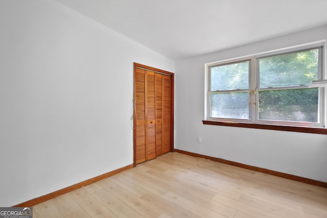 4365 US Highway 341, Jesup, GA 31545 - unfurnished bedroom featuring baseboards, light wood-style flooring, and a closet