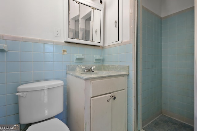 4365 US Highway 341, Jesup, GA 31545 - bathroom with vanity, toilet, tile walls, a shower stall, and a wainscoted wall