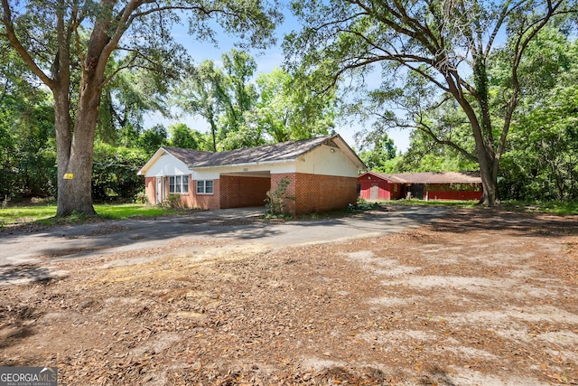 4365 US Highway 341, Jesup, GA 31545 - view of home's exterior featuring driveway, brick siding, and a carport