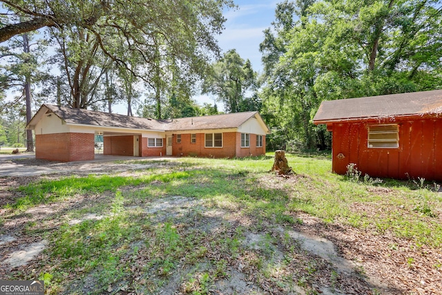 4365 US Highway 341, Jesup, GA 31545 - view of front facade with an attached carport, driveway, and brick siding
