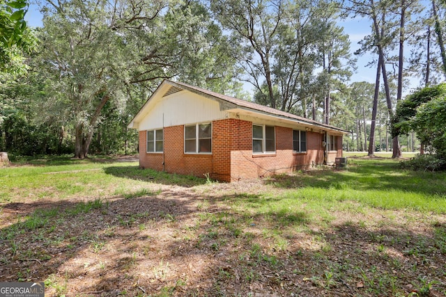 4365 US Highway 341, Jesup, GA 31545 - view of property exterior featuring brick siding and a lawn