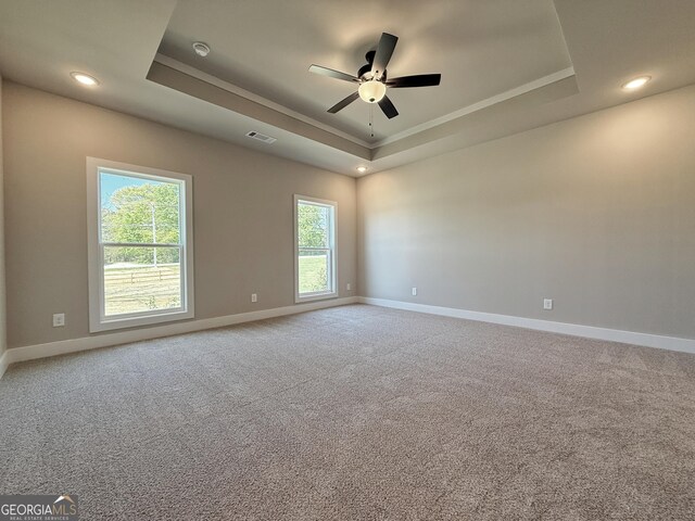 3132 Rosebud Rd Unit 1, Loganville, GA 30052 - carpeted empty room featuring visible vents, ornamental molding, baseboards, a raised ceiling, and a ceiling fan