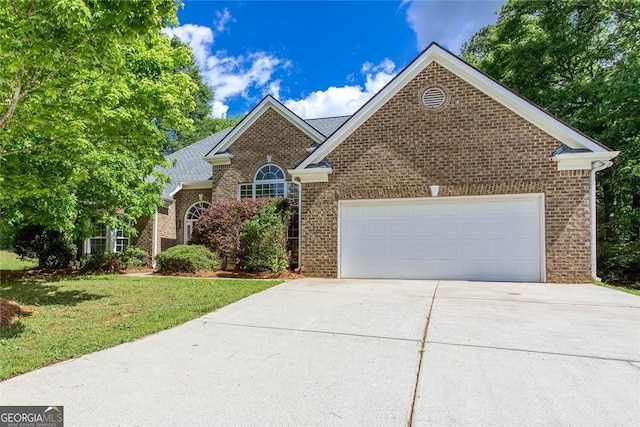 3314 Dilmus Dr, Powder Springs, GA 30127 - view of front facade with brick siding, driveway, an attached garage, and a front yard