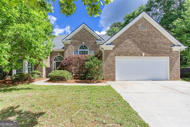 3314 Dilmus Dr, Powder Springs, GA 30127 - view of front of property featuring a garage, driveway, a front lawn, and brick siding
