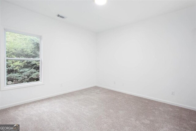 3314 Dilmus Dr, Powder Springs, GA 30127 - carpeted spare room featuring baseboards