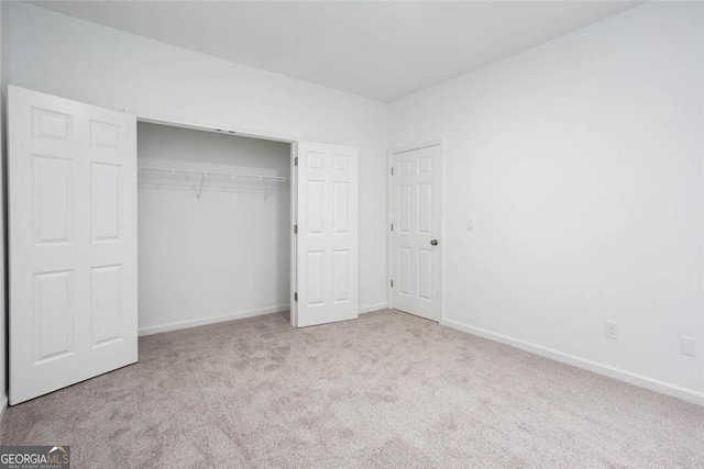 3314 Dilmus Dr, Powder Springs, GA 30127 - unfurnished bedroom with carpet flooring, baseboards, and a closet