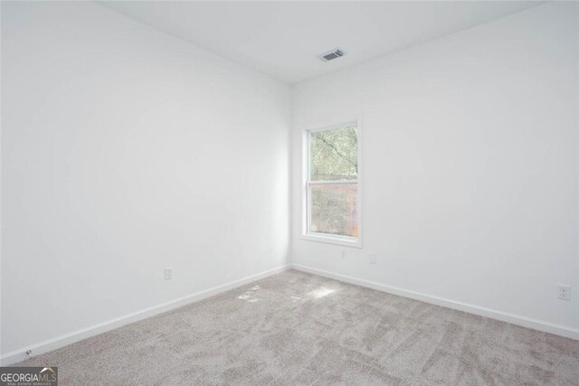 3314 Dilmus Dr, Powder Springs, GA 30127 - carpeted spare room with baseboards