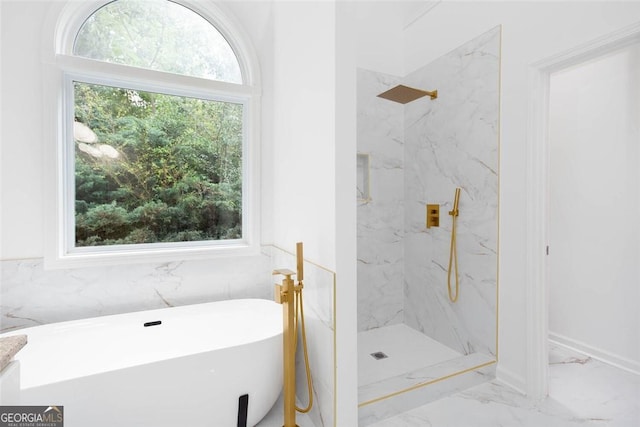 3314 Dilmus Dr, Powder Springs, GA 30127 - bathroom with a marble finish shower, marble finish flooring, and a freestanding tub