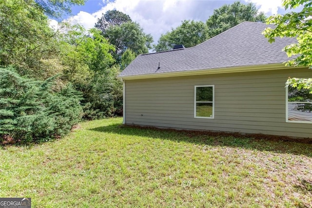 3314 Dilmus Dr, Powder Springs, GA 30127 - rear view of house featuring a yard and roof with shingles