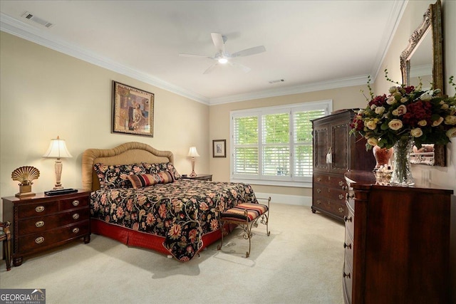 bedroom with ornamental molding, light carpet, and visible vents
