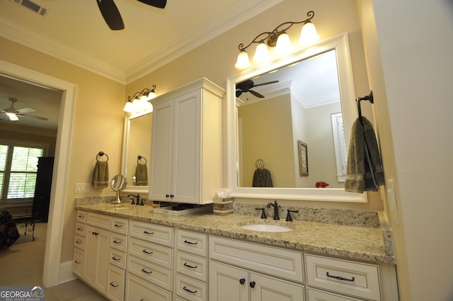 full bathroom with crown molding, a ceiling fan, visible vents, and a sink