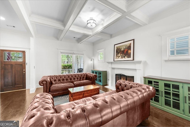 living area with coffered ceiling, a brick fireplace, plenty of natural light, dark wood-style flooring, and beamed ceiling