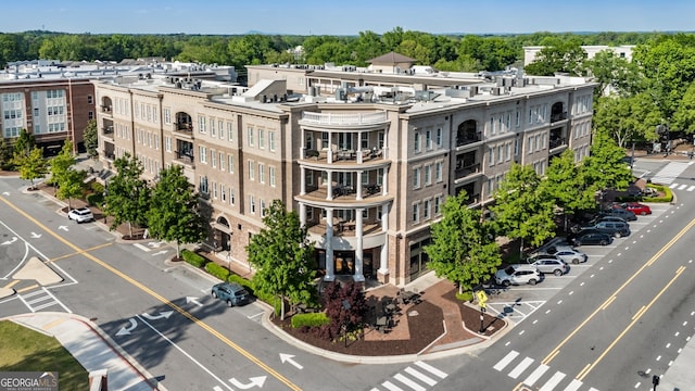 view of building exterior featuring uncovered parking