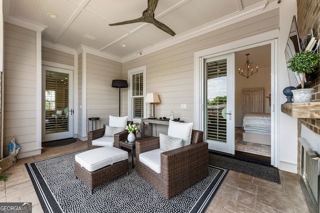 view of patio featuring ceiling fan