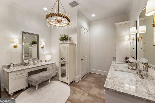 bathroom featuring ornamental molding, visible vents, a sink, a chandelier, and double vanity
