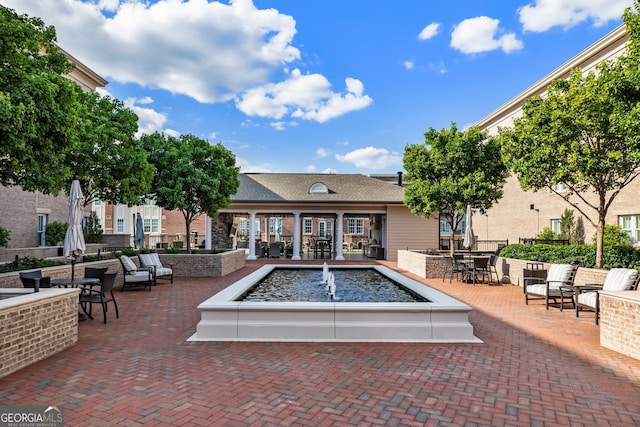 view of pool with a patio area and outdoor dining area