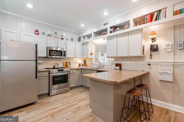 0 Vinson Mountain Rd, Rockmart, GA 30153 - kitchen with visible vents, open shelves, a peninsula, light wood-type flooring, and appliances with stainless steel finishes