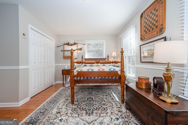 0 Vinson Mountain Rd, Rockmart, GA 30153 - bedroom featuring a closet, baseboards, wood finished floors, and a wainscoted wall