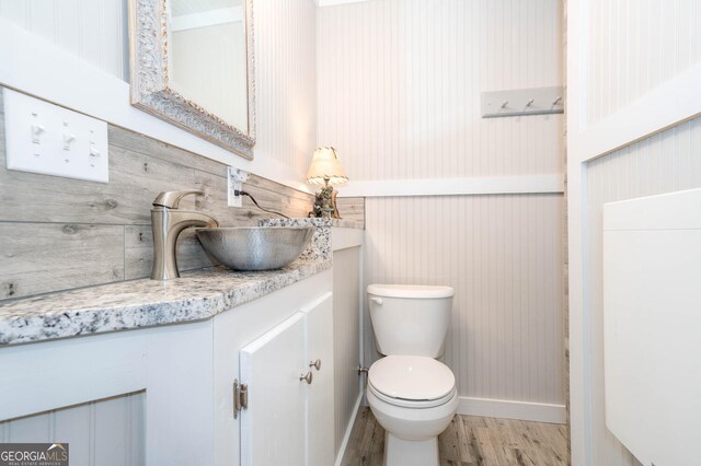 0 Vinson Mountain Rd, Rockmart, GA 30153 - half bath featuring toilet, baseboards, wood finished floors, and vanity