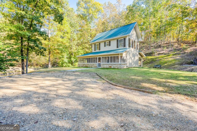 0 Vinson Mountain Rd, Rockmart, GA 30153 - view of front facade featuring a sunroom, a front yard, metal roof, and stone siding