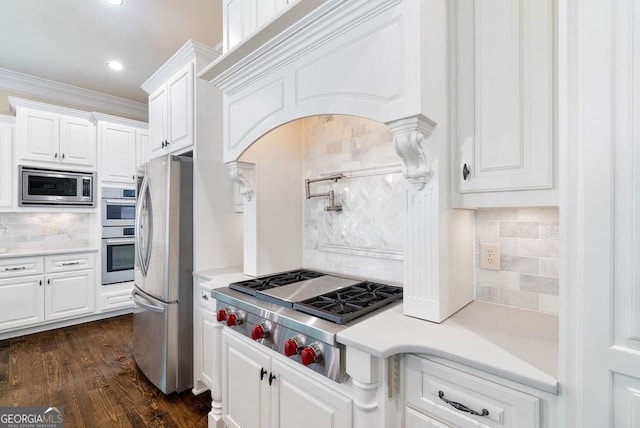 5475 Copper Creek Pass, Cumming, GA 30040 - kitchen with appliances with stainless steel finishes, tasteful backsplash, light countertops, white cabinets, and recessed lighting