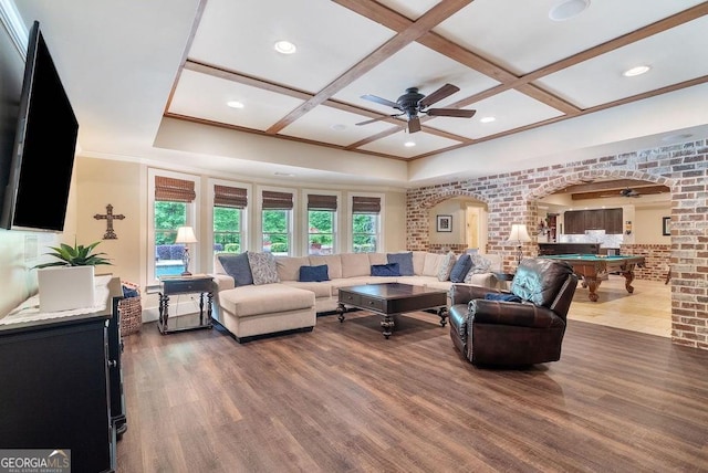 5475 Copper Creek Pass, Cumming, GA 30040 - living room featuring arched walkways, coffered ceiling, billiards table, ceiling fan, and wood finished floors