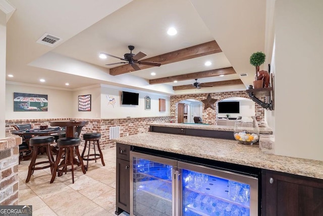5475 Copper Creek Pass, Cumming, GA 30040 - indoor dry bar featuring ceiling fan, beverage cooler, recessed lighting, and light stone finish flooring