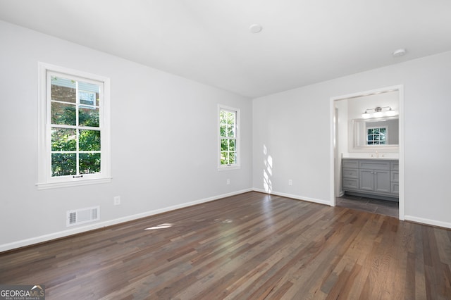 2690 Old Hickory Dr NW, Marietta, GA 30064 - unfurnished bedroom featuring dark wood finished floors, baseboards, a sink, and ensuite bath