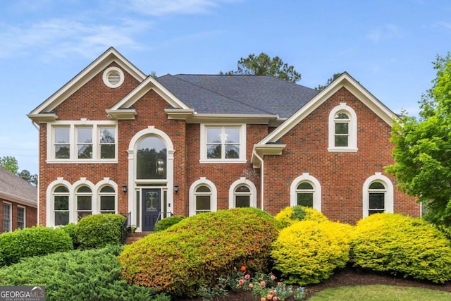 view of front facade featuring brick siding