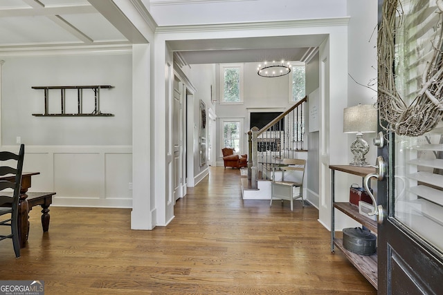 255 Ashmere Ct, Tyrone, GA 30290 - foyer entrance featuring stairway, crown molding, a chandelier, wood finished floors, and a decorative wall