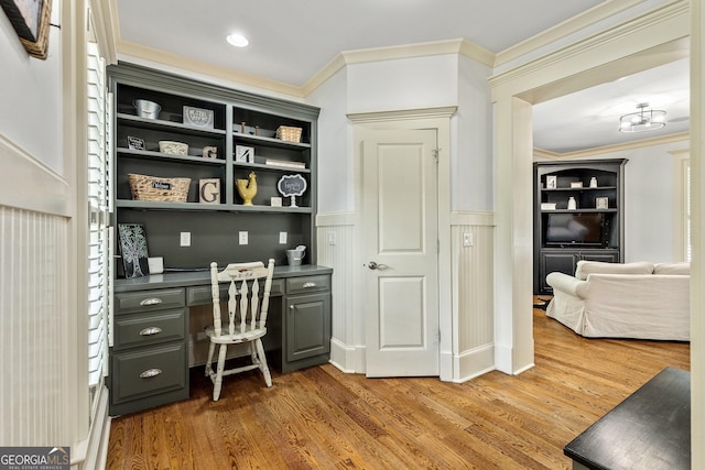 255 Ashmere Ct, Tyrone, GA 30290 - home office featuring crown molding, built in desk, wood finished floors, and wainscoting