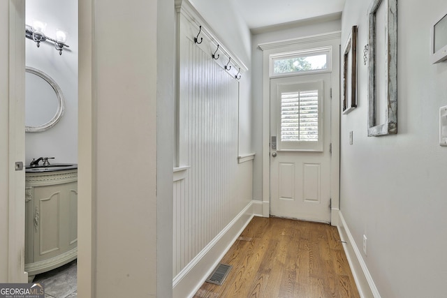 255 Ashmere Ct, Tyrone, GA 30290 - doorway with a sink, wood finished floors, and baseboards