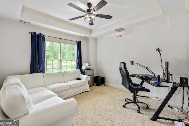 office area with a raised ceiling, ornamental molding, and carpet