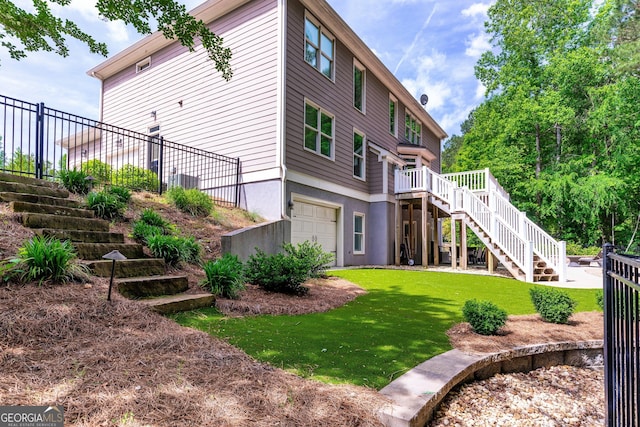 255 Ashmere Ct, Tyrone, GA 30290 - rear view of house featuring stairway, a garage, and a wooden deck