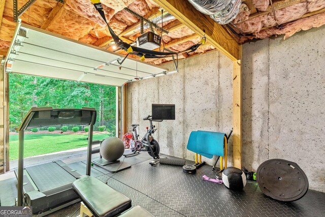 workout area with a garage