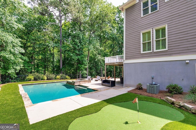 255 Ashmere Ct, Tyrone, GA 30290 - view of pool featuring an area to practice putting, a patio area, cooling unit, and a pool with connected hot tub