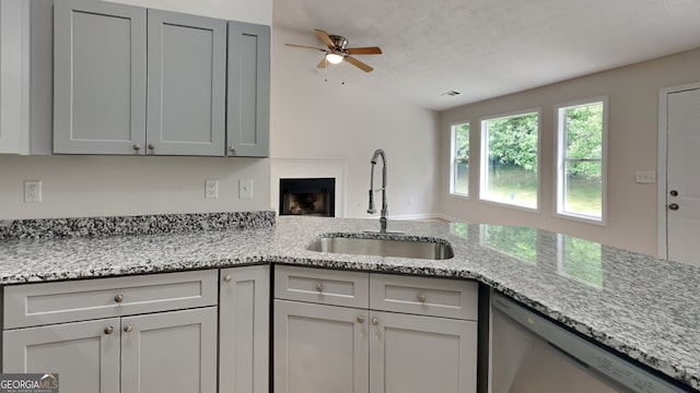 1229 Huntington Place Cir, Lithonia, GA 30058 - kitchen with gray cabinets, ceiling fan, a sink, and dishwasher
