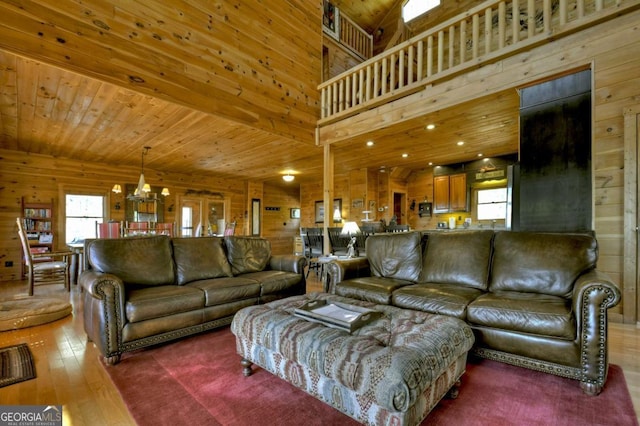 143 Katydid Rd, Morganton, GA 30560 - living area with wood walls, a wealth of natural light, and hardwood / wood-style flooring