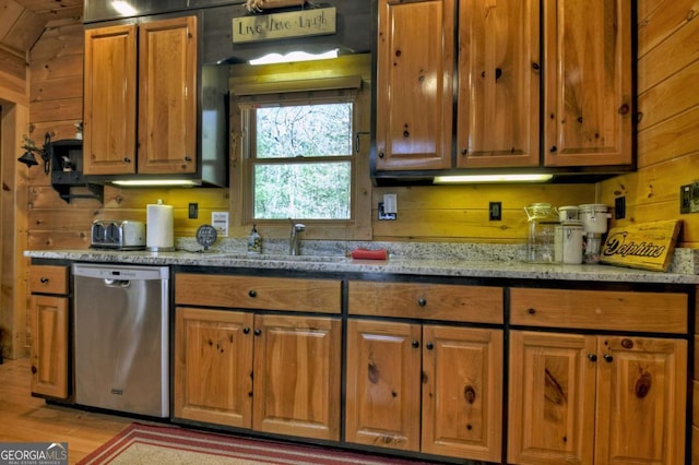 143 Katydid Rd, Morganton, GA 30560 - kitchen featuring brown cabinets, light stone counters, a sink, dishwasher, and light wood-type flooring